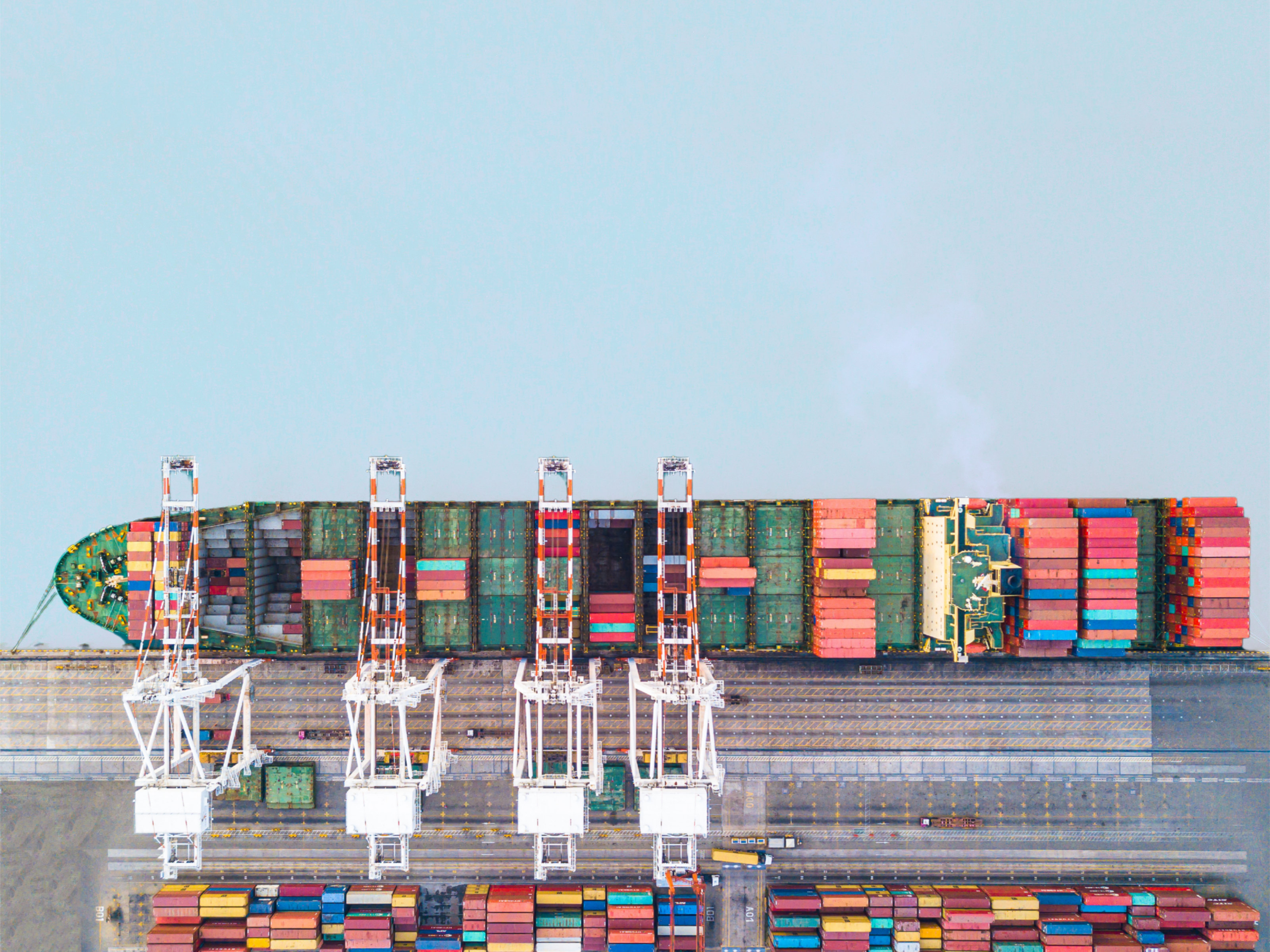 Aerial view of containers being loaded at port